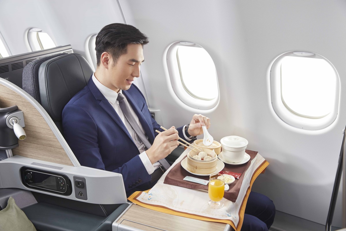 Passenger eating in Premium Laurel Class