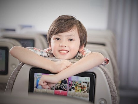 a child in an airplane seat(Premium Economy Class)