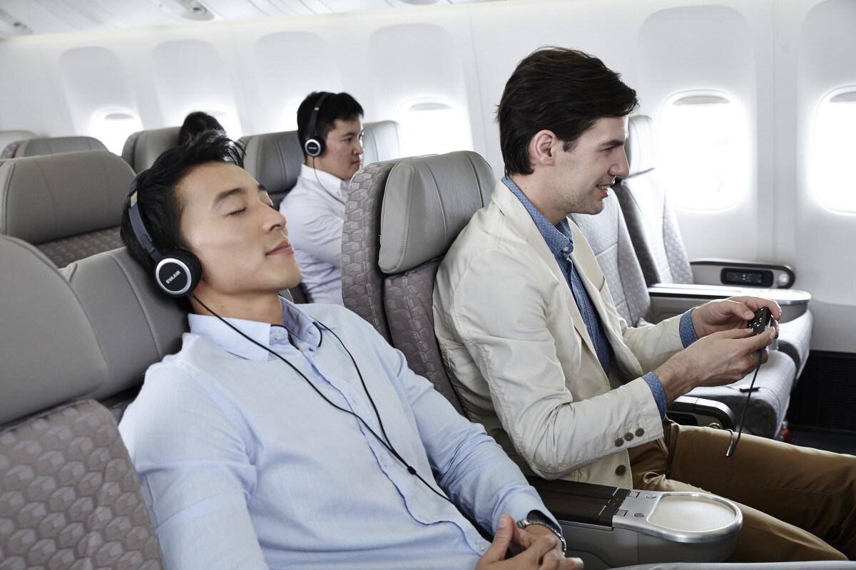 Passengers enjoying in Premium Economy Class