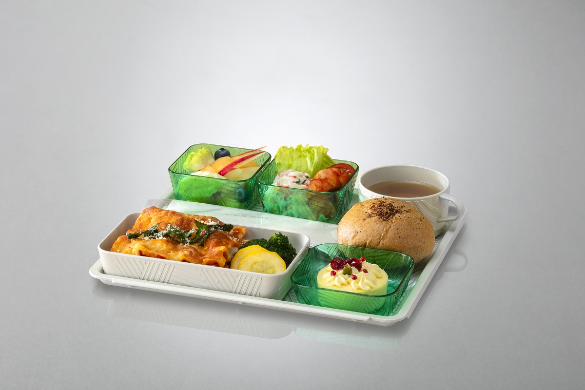 Passengers eating in Economy Class