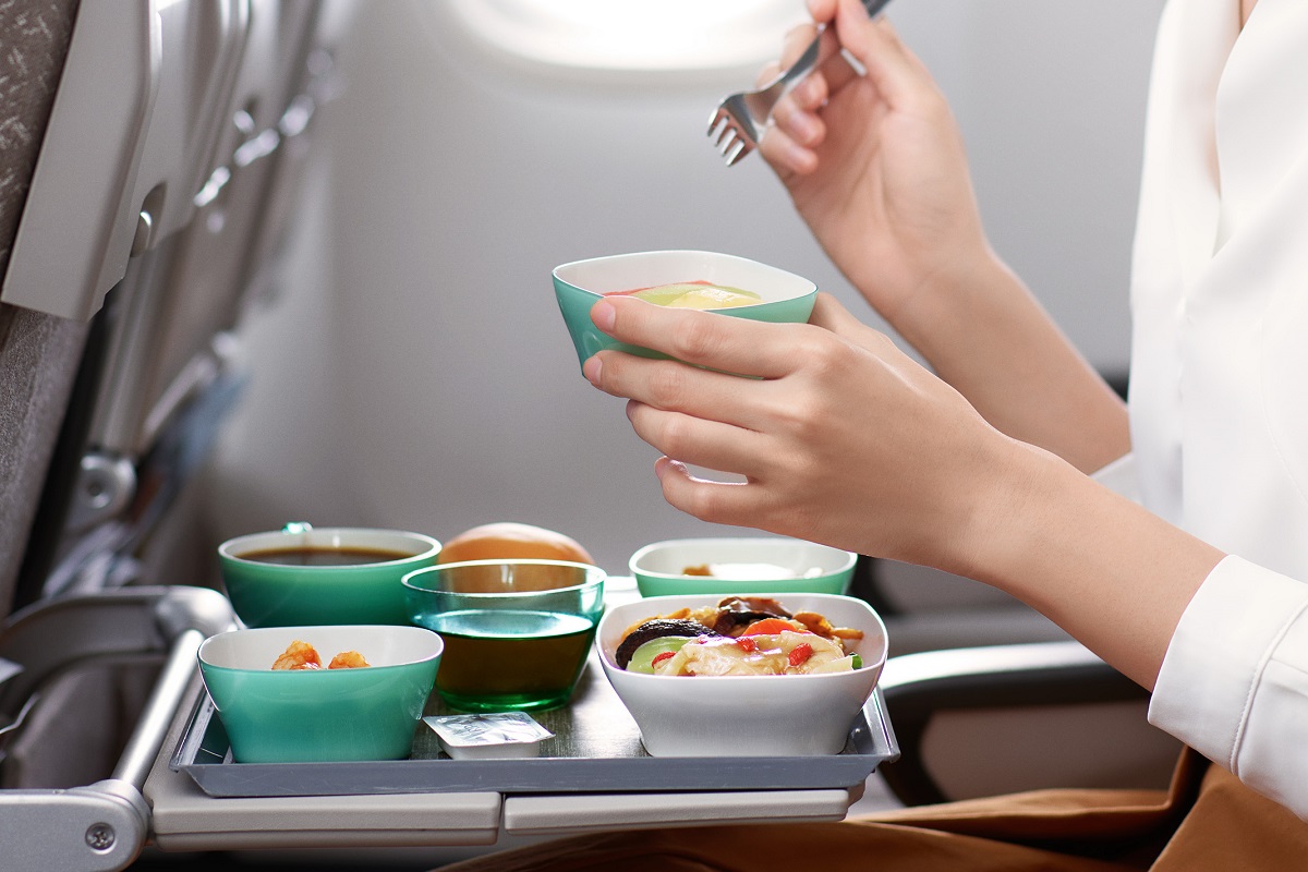 Passengers eating in Economy Class