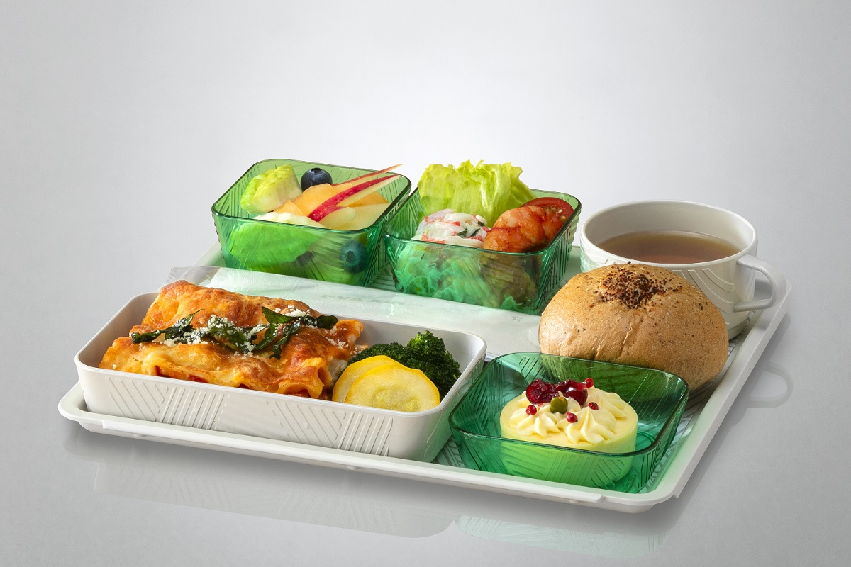 Passengers eating in Economy Class