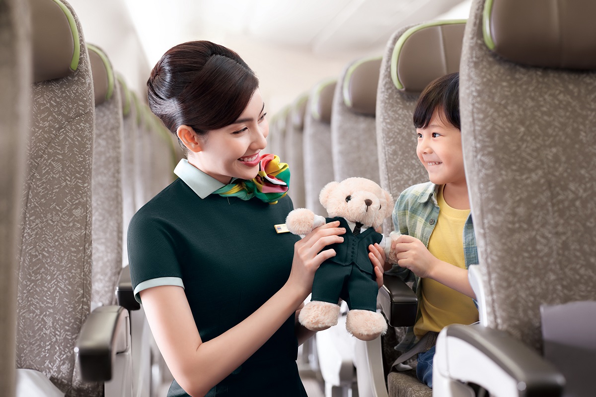 Passenger using inflight entertainment service in Economy Class