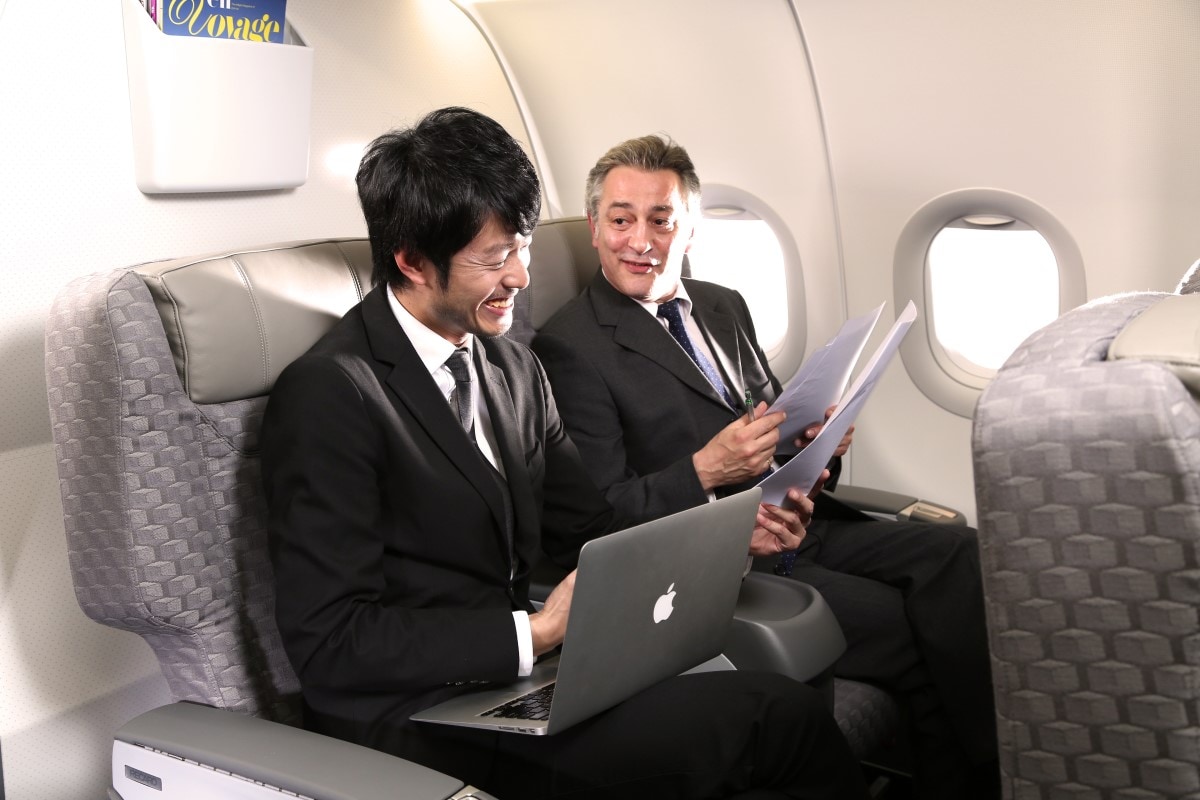 Men discussing in Business Class